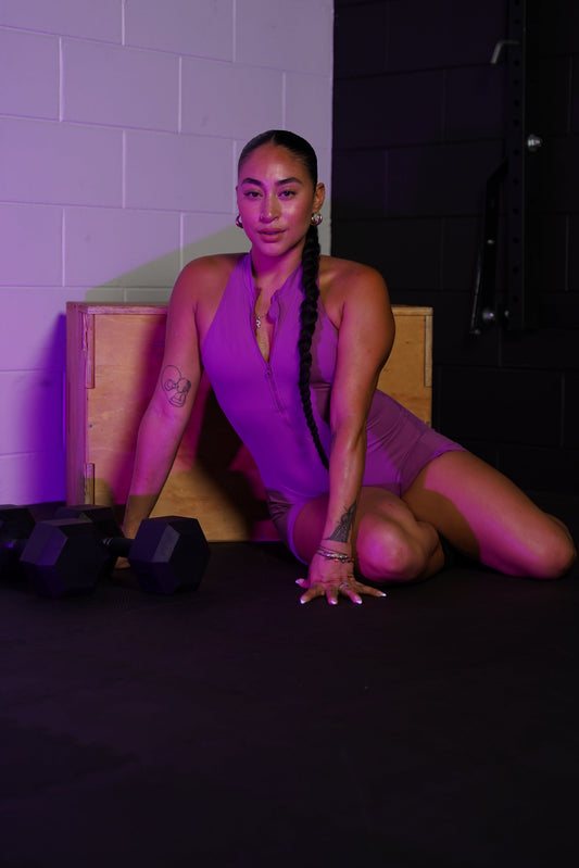An empowered woman focusing on her workout mindset during a training session.